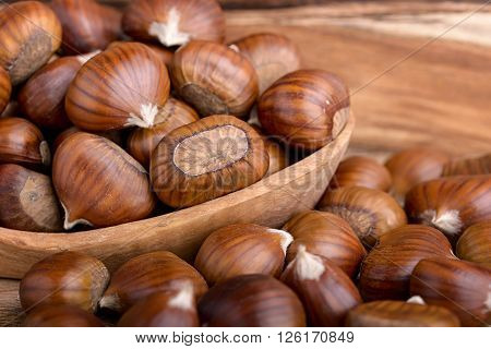 pile of chestnuts in a wooden bowl