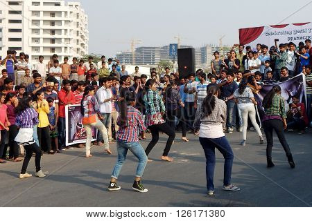HYDERABAD,INDIA-MARCH 27:Indian young people dancing on open road event on Sunday morning, celebrating World theater day on March 27,2016 in Hyderabad,India.