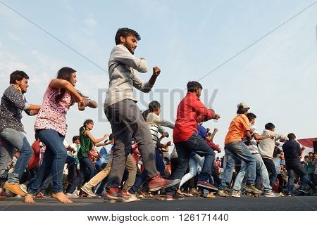 HYDERABAD,INDIA-MARCH 27:Indian young people dancing on open road event on Sunday morning, celebrating World theater day on March 27,2016 in Hyderabad,India.
