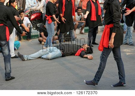 HYDERABAD,INDIA-MARCH 27:Nishumbita theatre group perform street play theme of Driving safe on road during raahgiri open road event on March 27,2016 in Hyderabad,India