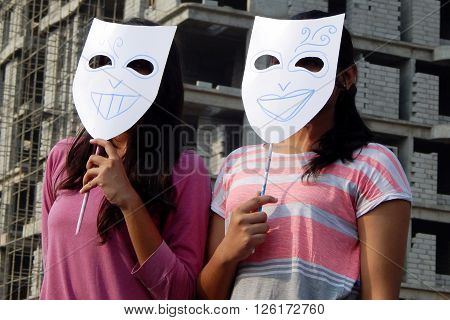 HYDERABAD,INDIA-MARCH 27:Indian young adult wear theatre masks during raahgiri open road event on March 27,2016 in Hyderabad,India