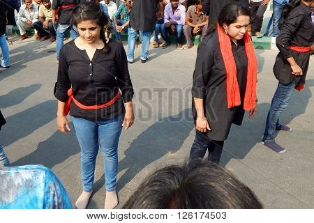 HYDERABAD,INDIA-MARCH 27:Nishumbita theatre group perform street play theme of Driving safe on road during raahgiri open road event on March 27,2016 in Hyderabad,India