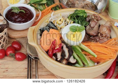 Bibimbap korean food is delicious placed on wood background