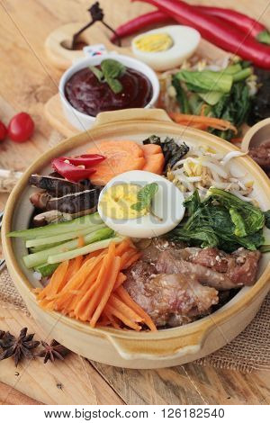 Bibimbap korean food is delicious placed on wood background