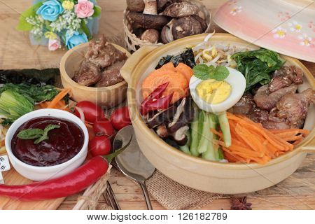 Bibimbap korean food is delicious placed on wood background
** Note: Visible grain at 100%, best at smaller sizes