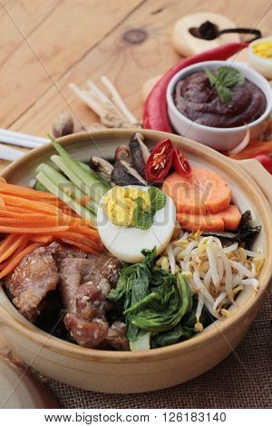 Bibimbap korean food is delicious placed on wood background
** Note: Visible grain at 100%, best at smaller sizes
