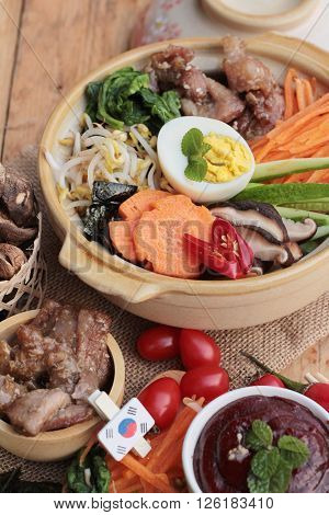 Bibimbap korean food is delicious placed on wood background
