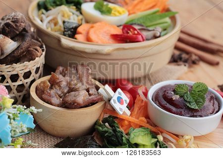 Bibimbap korean food is delicious placed on wood background