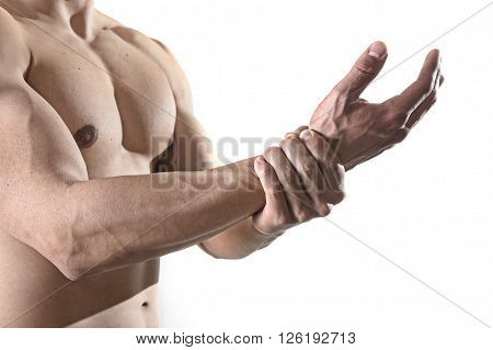young man with strong muscle body holding with hand his damaged wrist suffering pain in sport injury and health care concept isolated on white background