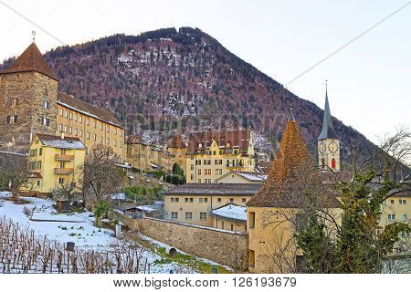 St Martin Church and vineyard of Chur in the morning. Chur is the capital of canton Graubunden in Switzerland. It lies in the Alpine Grisonian Rhine valley. The city is the oldest town of Switzerland