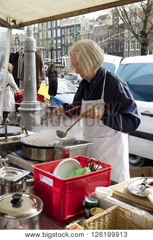 Amsterdam, Holland, April 9, 2016, Selling and making fresh crepes at the Noorder market  