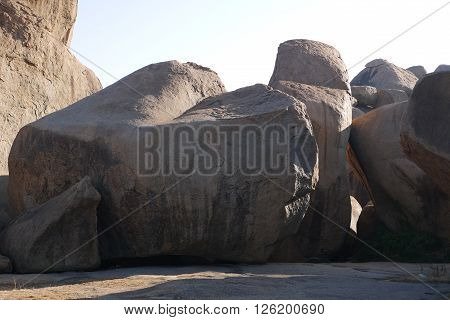 Stone boulders of Hampi in Kartanak's staff in India