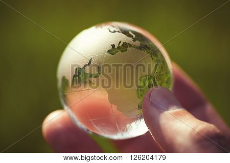 Macro Photo Of Glass Globe In Human Hand