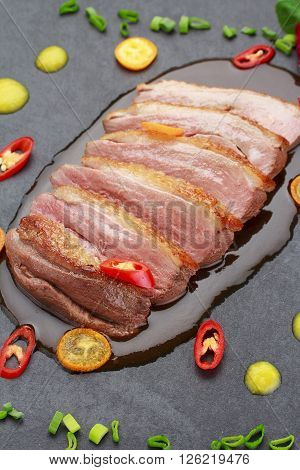 Pekin Duck With Vegetables Over Black Background