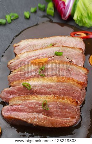 Pekin Duck With Vegetables Over Black Background