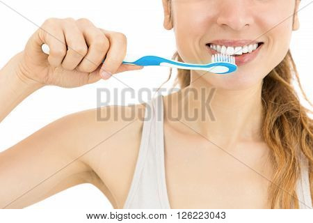 Caucasian woman brushing her teeth. Isolated on white background.