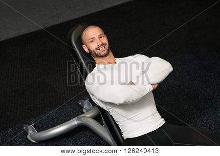 Young Muscular Men Resting After Exercises