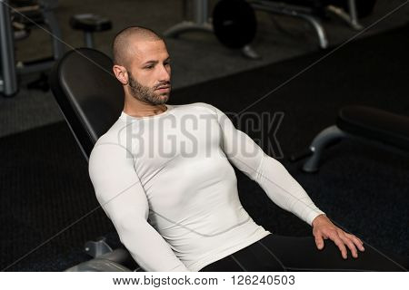Young Muscular Men Resting After Exercises