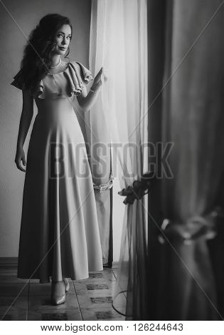 Portrait of beautiful woman in the beige dress