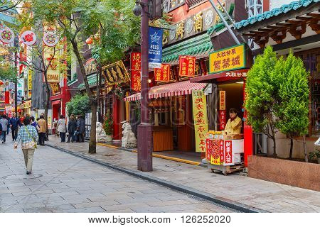 YOKOHAMA JAPAN - NOVEMBER 24 2015: Yokohama Chinatown is Japan's largest chinatown. A large number of Chinese stores and restaurants can be found in the narrow and colorful streets