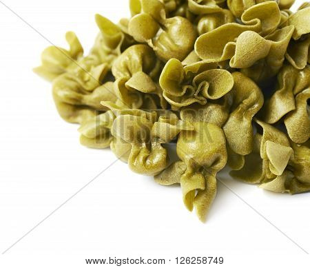 Pile of sacchettoni stuffed sacchetti pasta isolated over the white background, close-up crop fragment as a copyspace backdrop composition