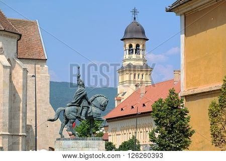 Michael the Brave's equestrian statue and bell tower Coronation Cathedral inside Carolina Citadel of Alba Iulia, Romania 