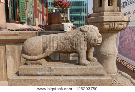SEOUL SOUTH KOREA - MARCH 14 2016: Stone statue of mythological creature Haechi in Jogyesa Temple of Seoul Korea. Haechi are believed to have the ability to judge between good and evil