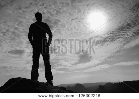 Hiker Stand On The Sharp Corner Of Sandstone Rock In Rock Empires Park And Watching  To Sun.