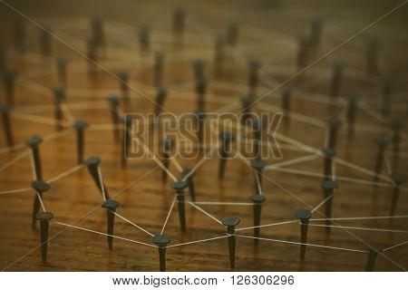 Rustic Nails In Wood Linked By Cotton