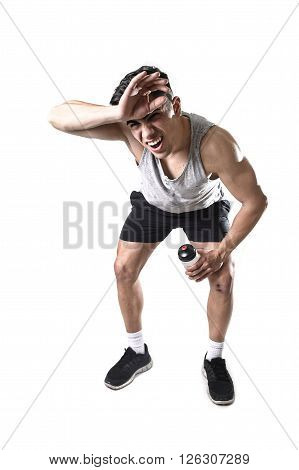 young attractive sport man with athletic fit body in exhausted and tired face expression breathing after hard training workout wet and sweaty isolated on white background in fitness healthy lifestyle
