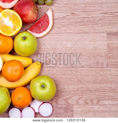 Fresh cut grapefruit with leaves. On a wooden table. Free space for text . Top view