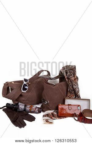 Set of brown autumn women's accessories handbags, sunglasses, belt, scarf and umbrella on a white background