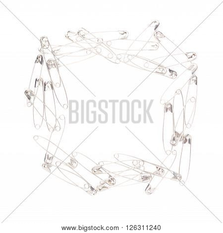 Square frame made of metal safety pins isolated on white background