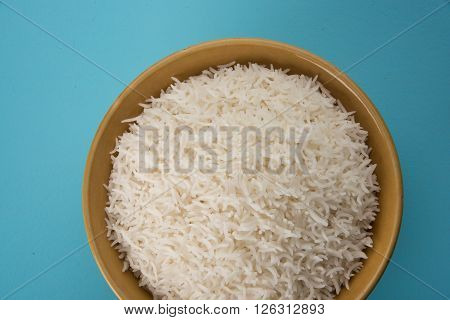 cooked white rice in a bowl, plain basmati rice, cooked basmati rice served in ceramic bowl