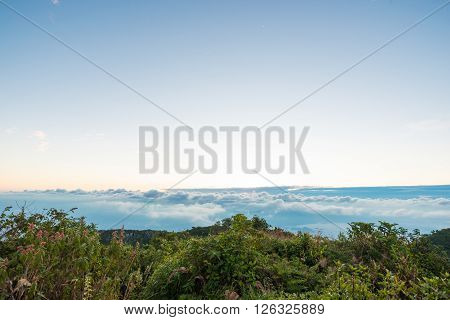 Sunrise On Peak Of Mountain With Fog White Cloud