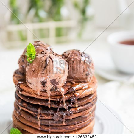 Stack Of Homemade Chocolate Pancakes With Chocolate Ice-cream