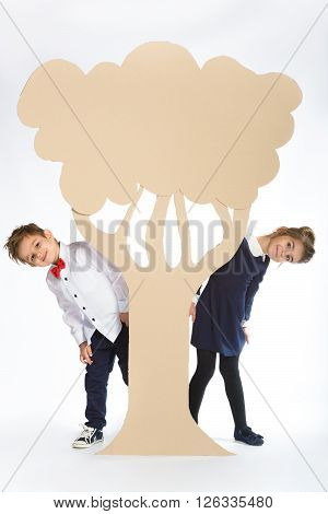 Love concept. Couple of kids. boy and girl with  cardboard flowers.