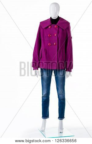 Purple coat with blue jeans. Mannequin wearing jeans and coat. Fleece outerwear for autumn. Lady's new coat on display.