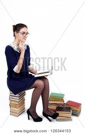 Young woman with books pile isolated on white