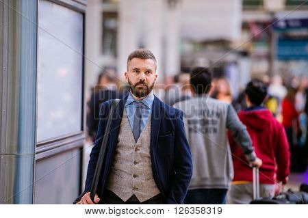 Young hipster businessman in blue suit at the staition walking
** Note: Visible grain at 100%, best at smaller sizes