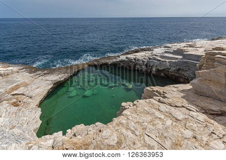 Green waters of Giola Natural Pool in Thassos island, East Macedonia and Thrace, Greece