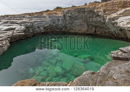 Clean waters of Giola Natural Pool in Thassos island, East Macedonia and Thrace, Greece