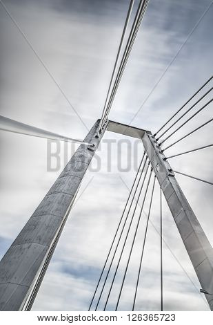 Cable Bridge in Umea Sweden with a cloudy sky.