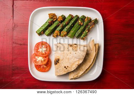 Indian masala fried bhindi or ladyfinger, curry, side dish with chapati, roti, naan, poori
