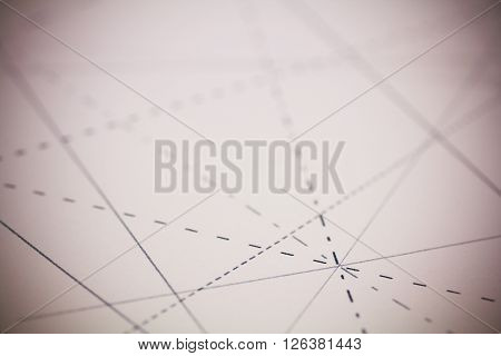 Black Pins In Paper Linked By Lines