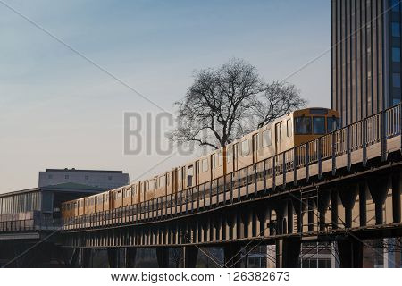 Berlin metro on a steel bridge in the city