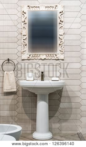 Lavatory and mirror in modern  bathroom interior