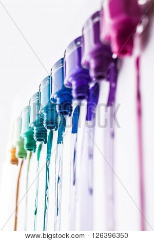 rainbow of nail polish isolated on a white background