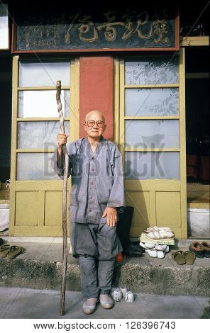 SONGNISAN NATIONAL PARK / KOREA - CIRCA 1987: A Buddhist monk poses for a photograph outside of his hermitage on a mountain in Songnisan National Park.