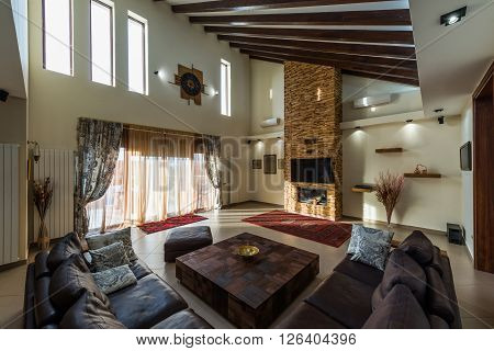 Intrior design of modern loft apartmentnt with fireplace